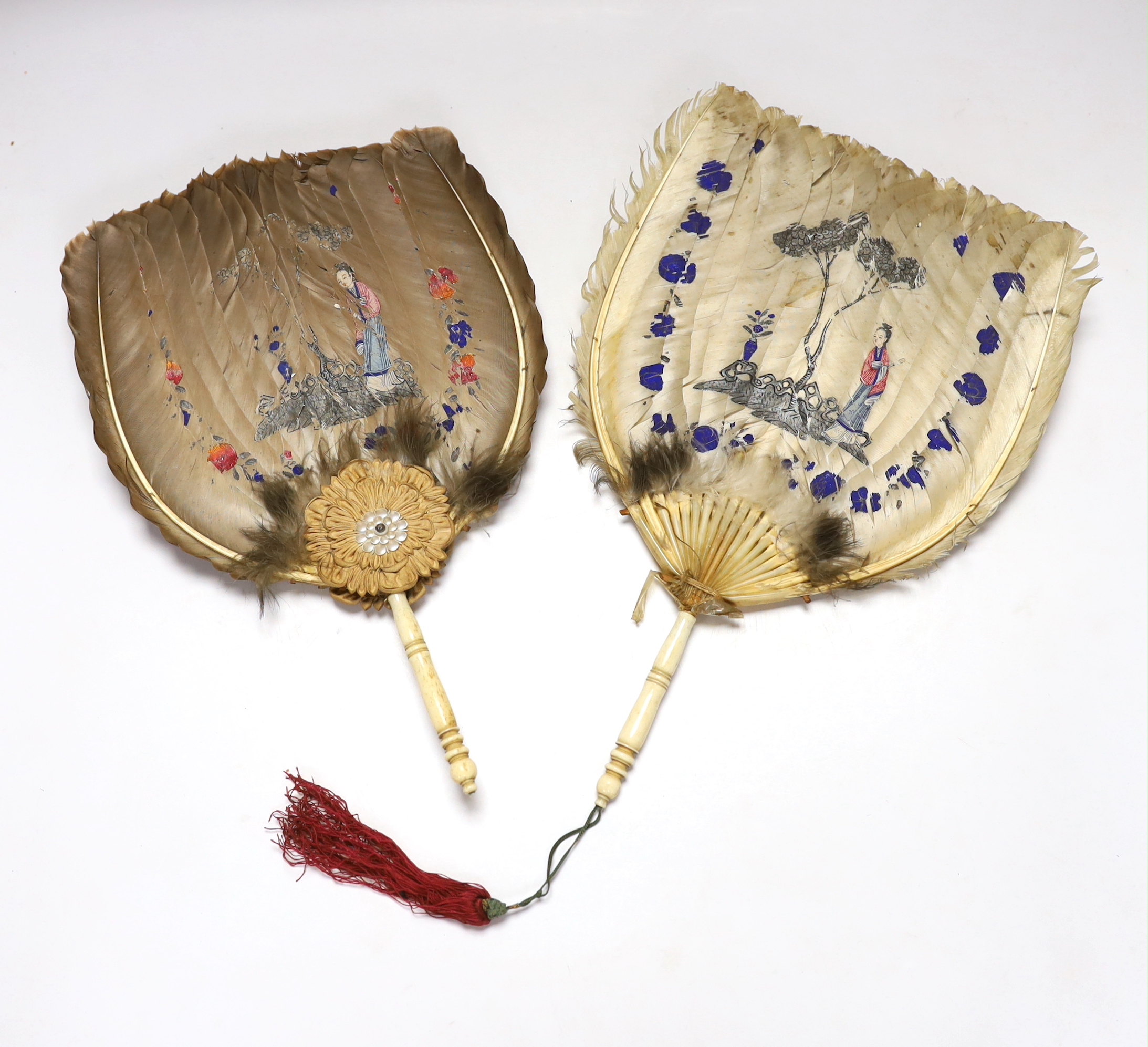 Two feather and bone handled Regency feather fans, the feathers hand painted with Chinese figures one side and flowers the other, one fan has silk rosettes with mother of pearl and feather ornamentation to the top of the